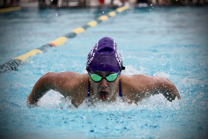 Swimmer practicing technique in a pool