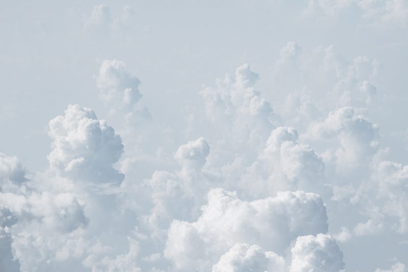 A picturesque view of white clouds against a blue sky