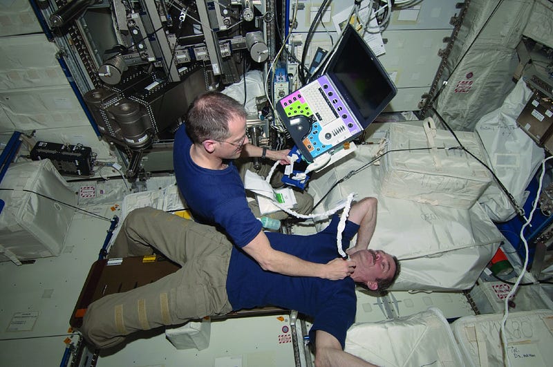 Astronauts undergoing medical examinations in space.