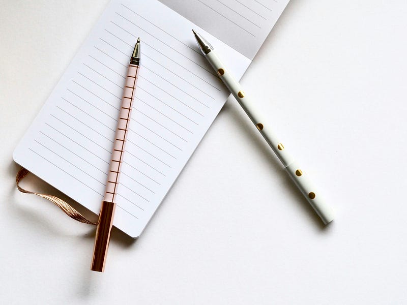 A stylish notebook and pen on a desk